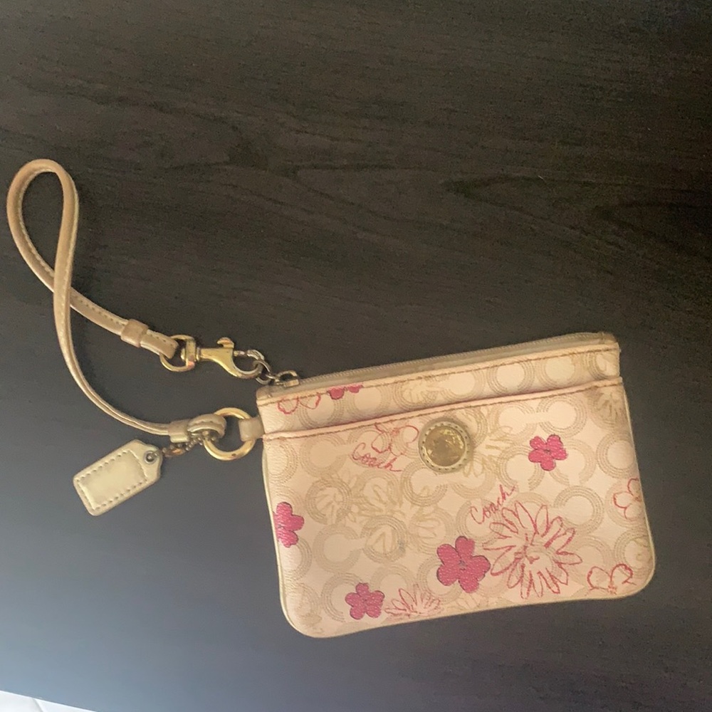 Coach wristlet cream with pink flower 🌸 design